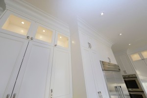 Crown moulding accents the floor to ceiling cabinets.