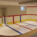 Another view of the hockey rink, featuring a custom penalty box.
