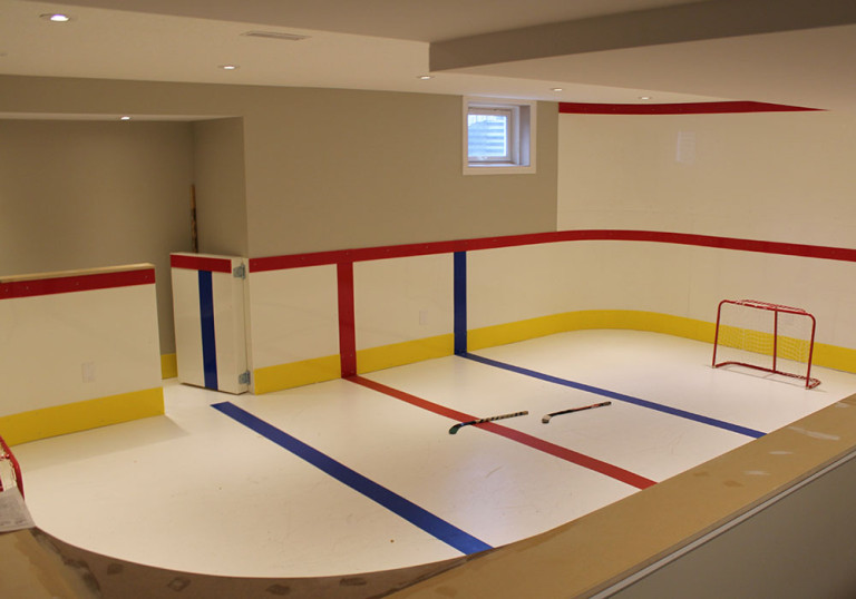Another view of the hockey rink, featuring a custom penalty box